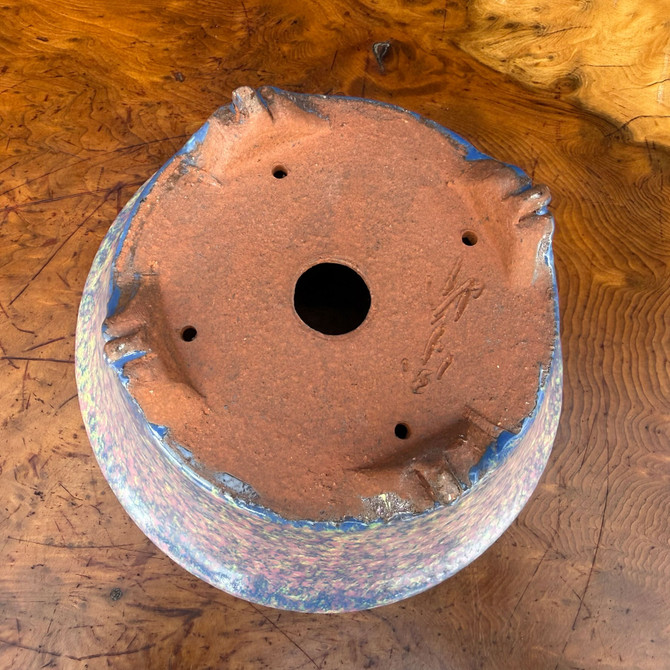 Bottom view of Shuho handmade bonsai pot showing decorative feet, drainage hole, and artist chop