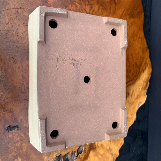 Bottom view of Yamafusa Tokoname rectangle bonsai pot showing signature, feet, and drainage holes