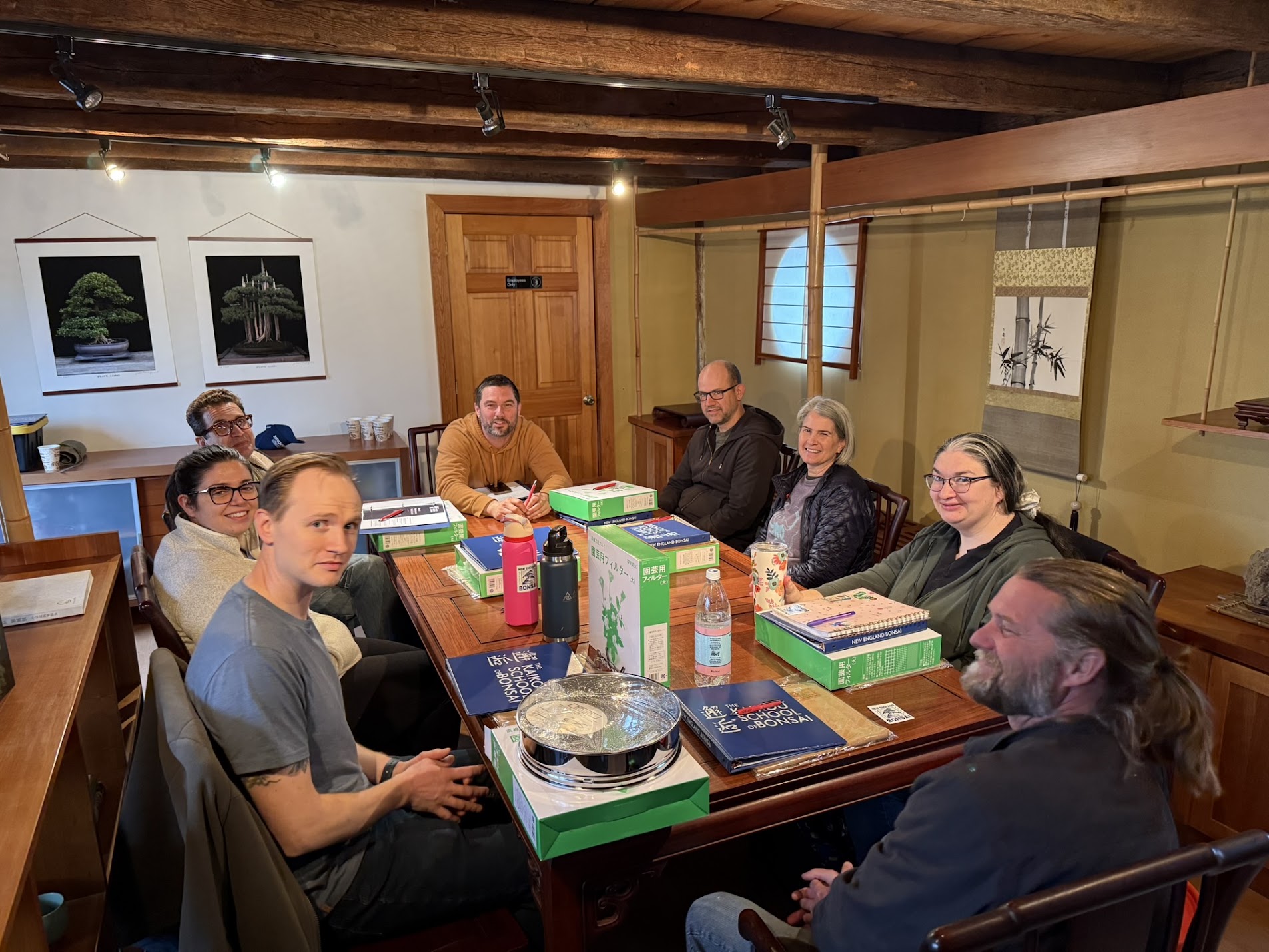 A group gathered around the table in the Japanese tea room
