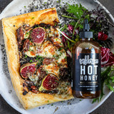 WilderBee Hot Honey drizzled on pizza WilderBee Hot Honey drizzled on pizza