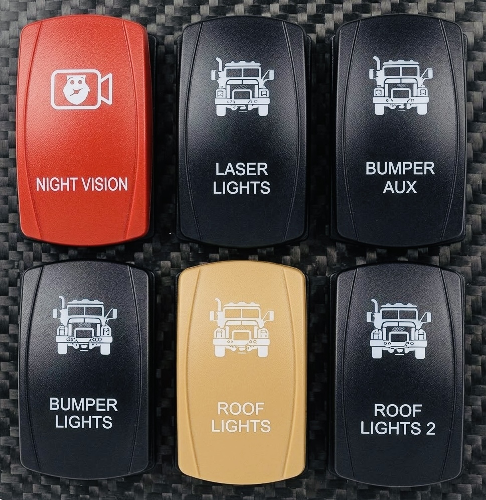 Custom laser-engraved rocker switches including a red Night Vision switch on carbon fiber