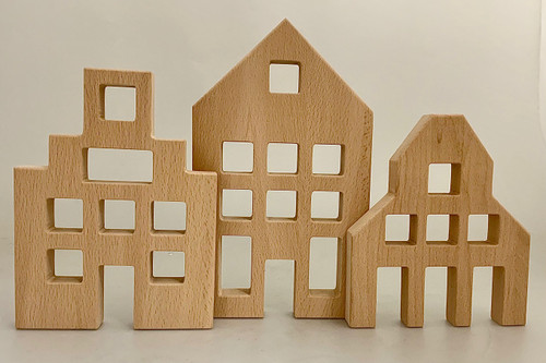 The Houses are 17.5, 20 and 25cm high.
Our new, soon to come, Lucite blocks will be able to fit in the window and door spaces. Also the Bauspiel cubes will be a perfect fit. Made from all natural Beech Wood. Sold as a set of 3
