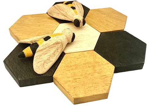 Two bees and 7 hexagonal wood pieces that form a flower shape.