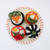 4 Special Sushi rolls with all delicious toppings, presented on a felt plate.