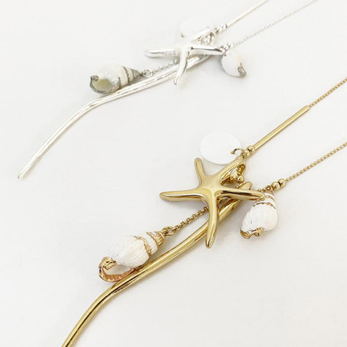 Collier Necklace Gold Long Necklace With Assorted Charms And Naturel Shells by Caracol