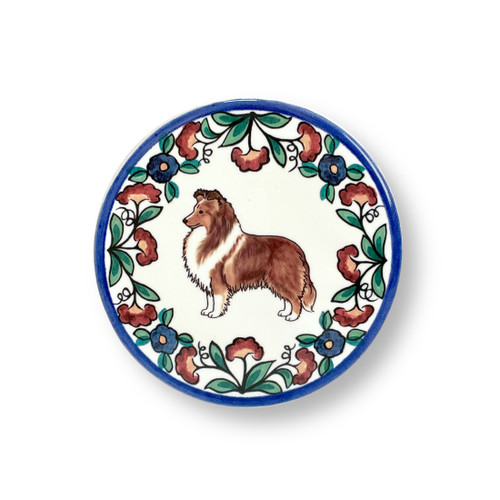 Handmade ceramic drink coaster featuring a sable Shetland Sheepdog (Sheltie) with floral design, perfect for dog lovers and Sheltie owners.