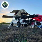 HD Nomadic 90 Degree Awning - Grey Body, Green Trim & Black Travel Cover Lifestyle
