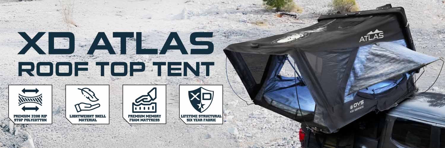 OVS XD Atlas cantilever hardshell roof top tent deployed on vehicle overlanding campsite setup