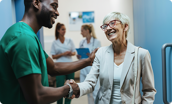 Healthcare professionals greeting a patient