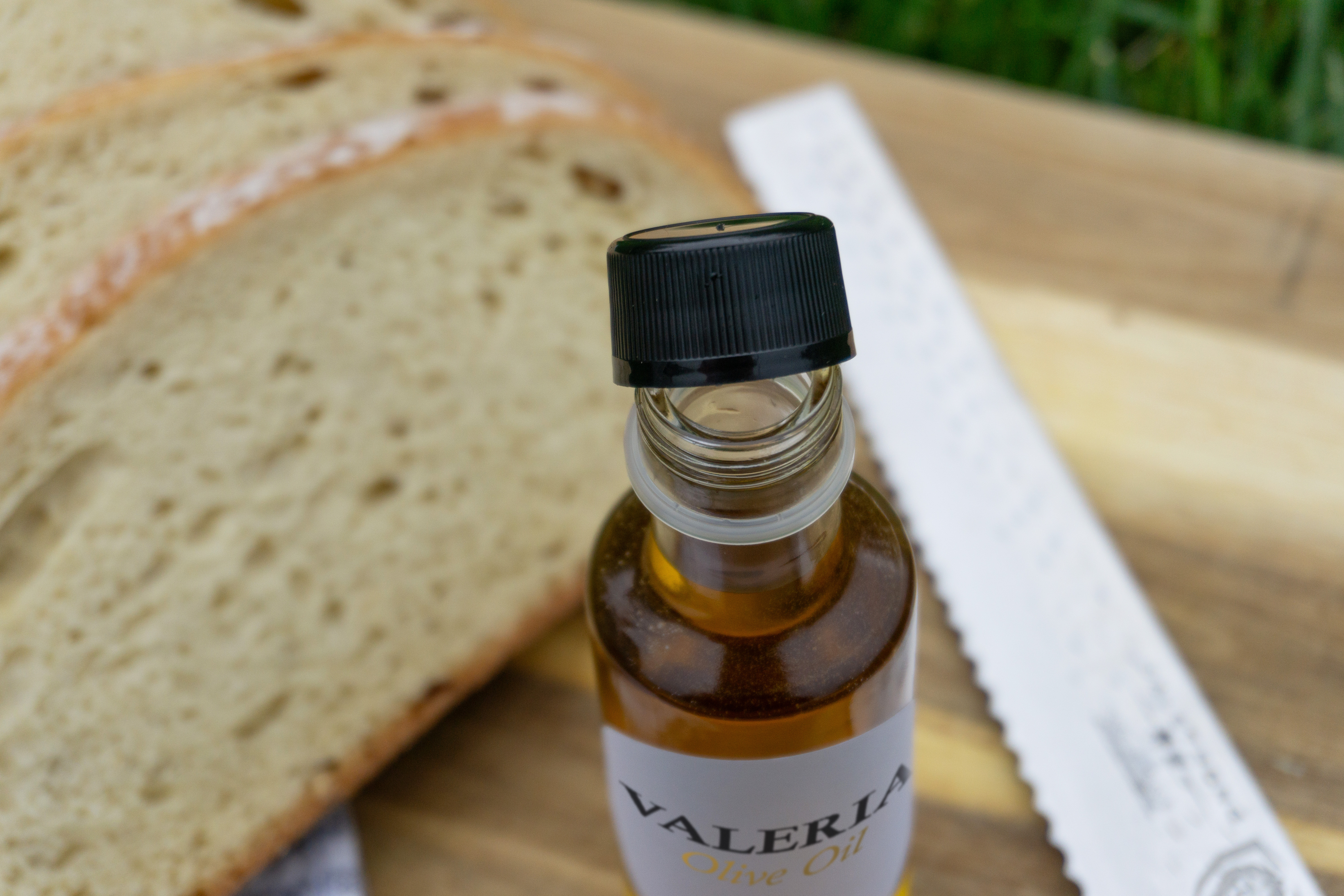 Olive oil bottle with tamper evident cap for promotions banner