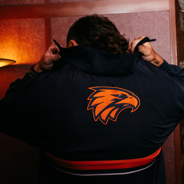 West Coast Eagles New Balance Adult Gather Round Parachute Jacket Ochre (2026)