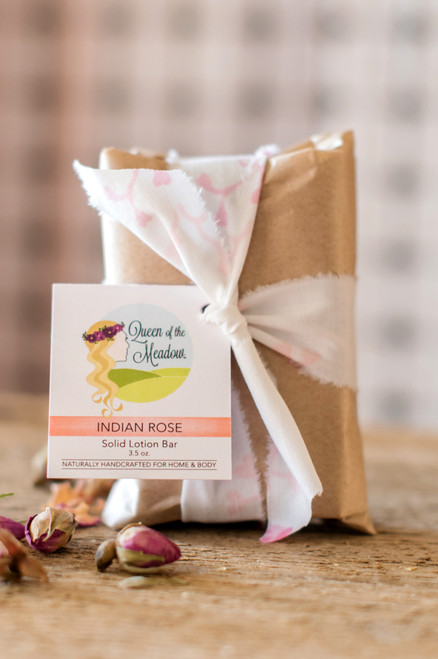 The image showcases a Lotion Bar, emphasizing its effectiveness as the best natural moisturizer for dry skin. The Lotion Bar is presented alongside various scent options, offering viewers the opportunity to choose their favorite fragrance from options such as Almond, Indian Rose, Jasmine, Lavender, Sage, unscented, and Vanilla.