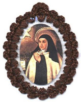 Crocheted relic badges of St. Teresa of Avila, badge of St. Teresa of Avila with relic, cloth touched to the relic of the saint