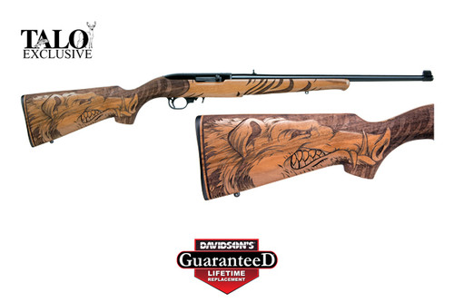 This is a 10/22 chambered in 22 long rifle, Manufactured by Ruger. This Talo special edition has a Wild Hog engraved into the Walnut stock.