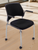 300 Lbs. Capacity Black Padded Mobile Stacking Chair with Armrests