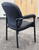 4-Leg Black Vinyl Guest Chair with Padded Arms - 400 lbs Cap.