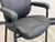 4-Leg Black Vinyl Guest Chair with Padded Arms - 400 lbs Cap.