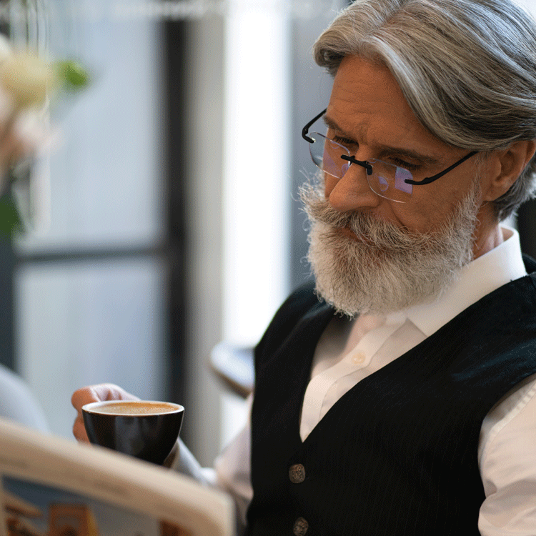 Gels Square Progressive Reading Glasses in Tortoise worn by man reading
