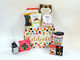 Celebrate Every Little Thing Gift Basket features assorted celebratory snacks and colorful ceramic travel mug