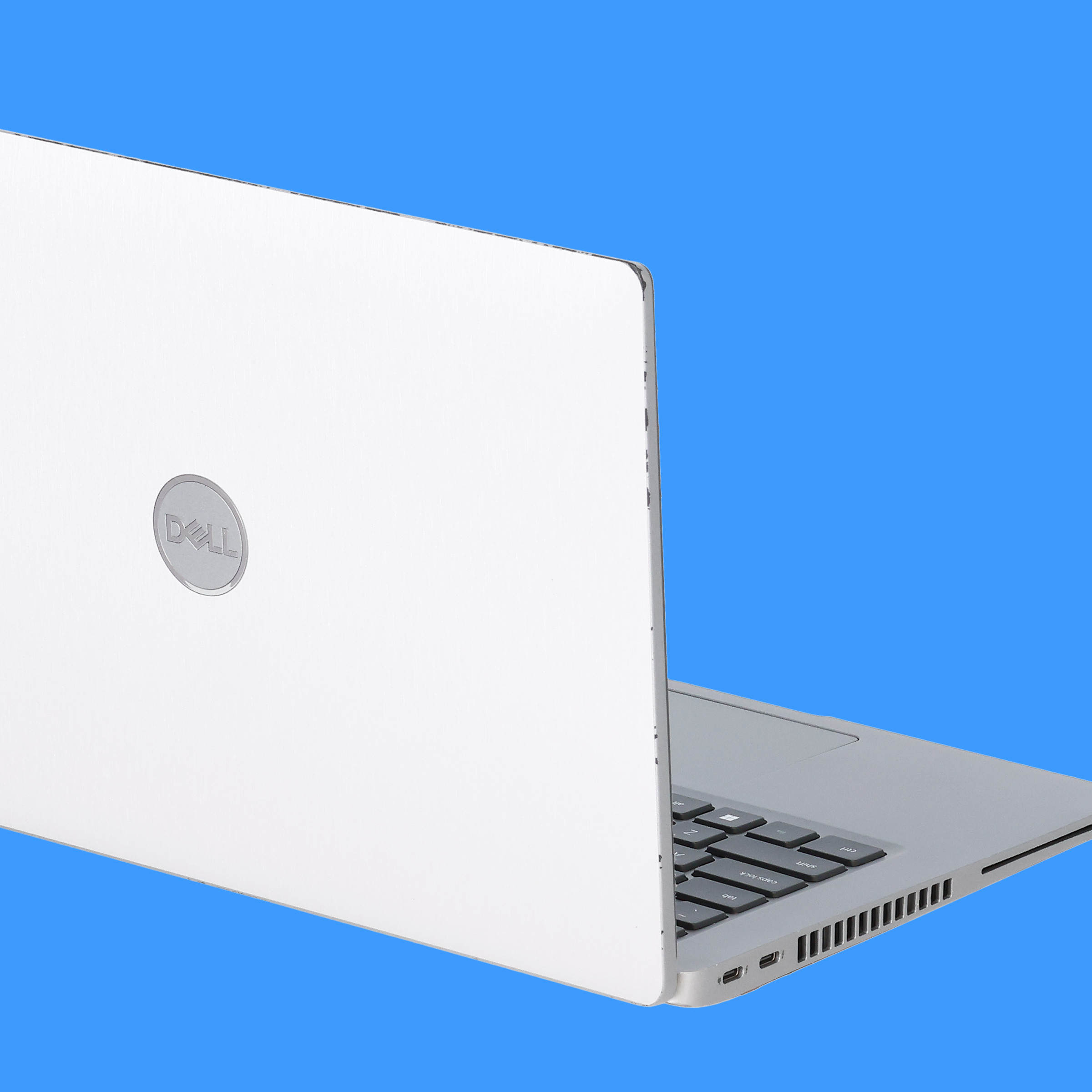 Missing finish or scuffs on the edge of a Dell laptop lid