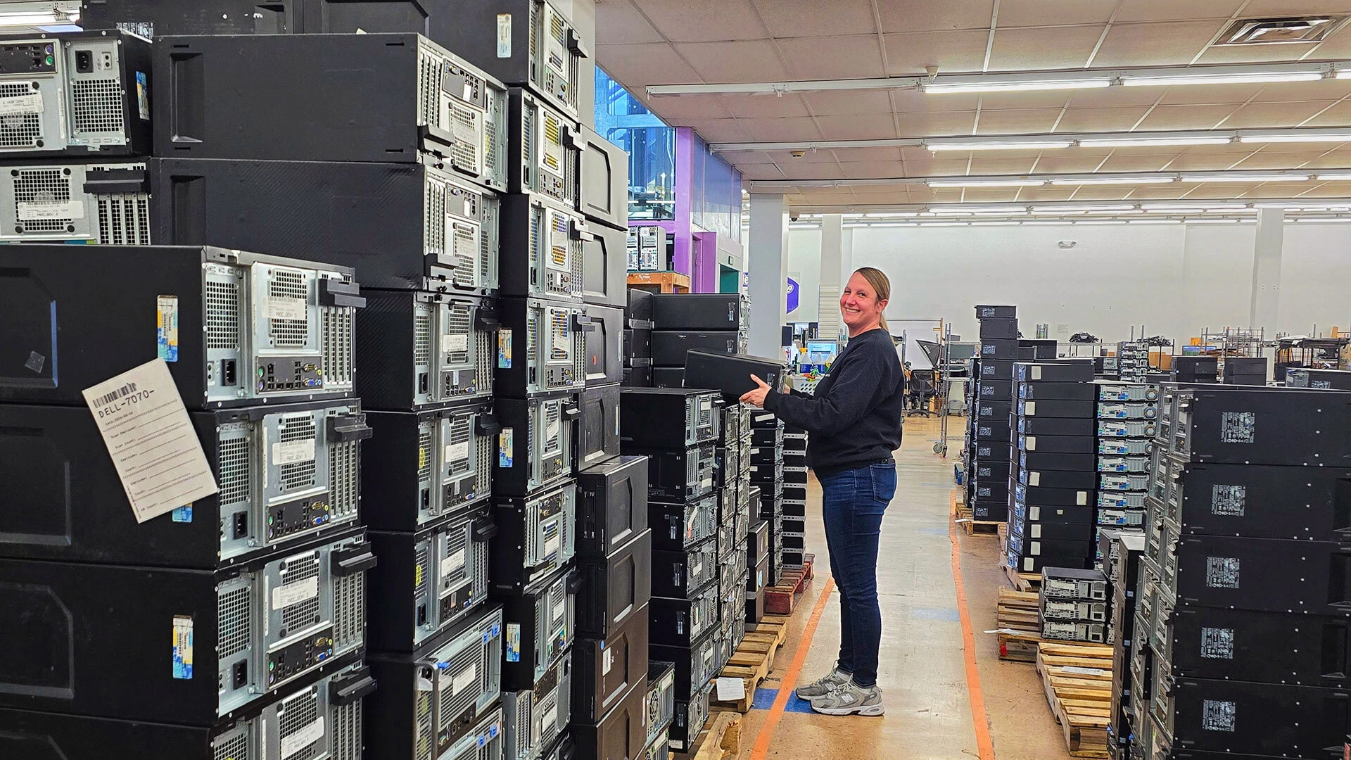 A BlairTech team member stocking PCs