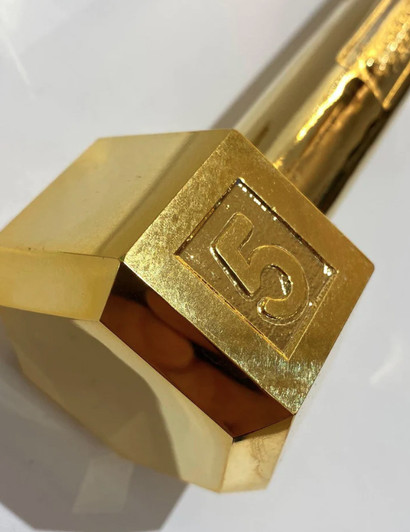 Close up of Gold Dumbbell