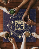 Tea Gathering Around Casting Cloth – Intuitivitea cloth at the center with cups of black, green, white, and herbal teas.