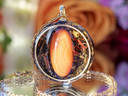 Close-up of I AM Confident pendant featuring AAA Orange Banded Agate set in gold inset ring