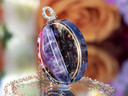 Side view of amethyst tea-infused pendant showing layered eco resin depth