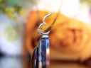 Detail of 14k gold-filled snap latch bail attached to round pendant
