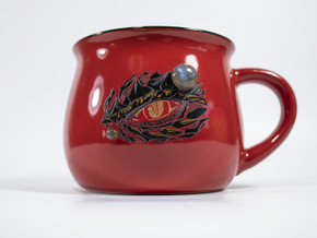 Close-up angled view of red Dragons eye mug with matte gold design, crescent moon, stars, and Labradorite accents. Close-up angled view of red Dragons eye mug with matte gold design, crescent moon, stars, and Labradorite accents.