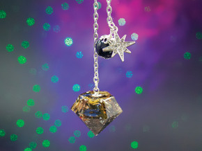 Starry Night pendulum with blue goldstone bead and silver eight-pointed star charm, handmade with white tea leaves, rose petals, cornflowers, saffron, and silver leaf. Starry Night pendulum with blue goldstone bead and silver eight-pointed star charm, handmade with white tea leaves, rose petals, cornflowers, saffron, and silver leaf.