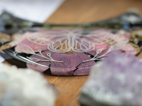 Close-up highlighting the layered petals and etched butterfly design shimmering in resin. Close-up highlighting the layered petals and etched butterfly design shimmering in resin.