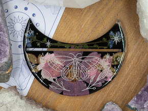 Pink blossoms, blue flowers, and leaves set in ECO resin with celestial white butterfly detailing. Pink blossoms, blue flowers, and leaves set in ECO resin with celestial white butterfly detailing.