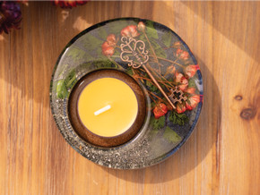 Overhead view of the Dark Secret Garden Candle Holder, showcasing a circular resin design with vibrant roses, a copper key, and golden flecks of pyrite. Overhead view of the Dark Secret Garden Candle Holder, showcasing a circular resin design with vibrant roses, a copper key, and golden flecks of pyrite.