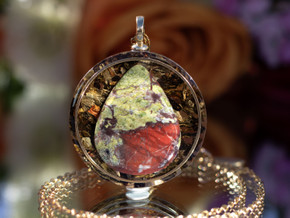 Close-up of I AM Courageous pendant featuring AAA Dragon Blood Jasper set in gold inset ring