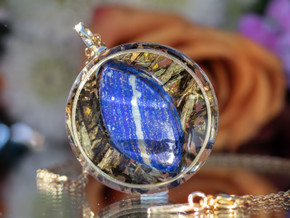 Close-up of I AM Intuitive pendant featuring AAA Sodalite set in gold inset ring