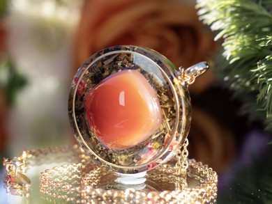 Close-up of I AM Fire pendant featuring AAA Carnelian set in gold inset ring