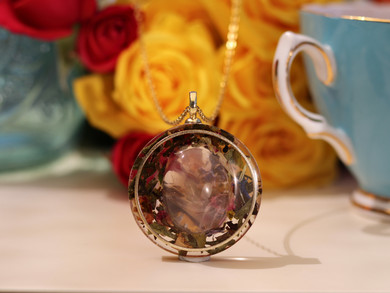 Handmade Self-Acceptance pendant featuring a large polished AAA Rose Quartz surrounded by White Tea and preserved botanicals.