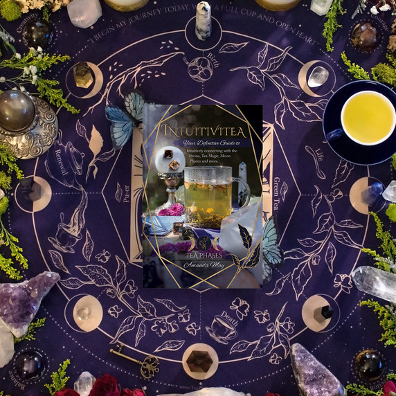 Cloth, Book, and Dice with Crystals – Intuitivitea casting cloth and guidebook surrounded by tea dice, botanicals, and stones.