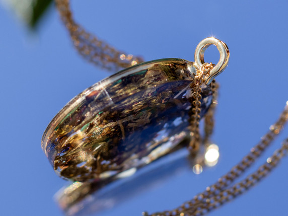 Gold chain and clasp detail of malachite transformation pendant