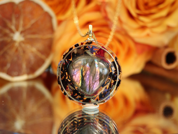 I See Beyond the Veil handmade pendant featuring AAA purple labradorite, black tea and botanicals preserved in clear resin.