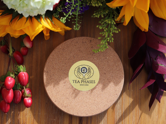 Natural cork base of the handmade Autumn Alchemy candle holder with Tea Phases label.