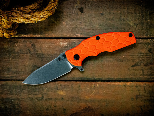Jurassic-Slicer Hollow Ground-Magnacut-Stonewash Gold-Orange Scaled G10-Black Nitride Hardware/TS