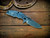 Assembly Special-Jurassic-Slicer Hollow Ground-Magnacut-Stonewash Blue-BlueG10-Black Nitride Hardware-Lockside