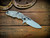 Assembly Special-Jurassic-Slicer Hollow Ground-Magnacut-Bead Blast-Orange/Black G10-Black Nitride Hardware-Lockside