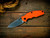 Assembly Special-Jurassic-Slicer Hollow Ground-Magnacut-Stonewash Gold-Orange Scaled G10-Black Nitride Hardware/TS-Scale Side