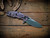 Assembly Special-Jurassic-Slicer Hollow Ground-Magnacut-Stonewash Purple-Orange/Black G10-Black Nitride Hardware/Orange Standoff-Lockside