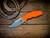 Jurassic-Frontier Clip Point-Magnacut-Stonewash-Orange G10