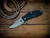 Jurassic-Frontier Clip Point-Magnacut-Battle Bronze-Blue Black G10
